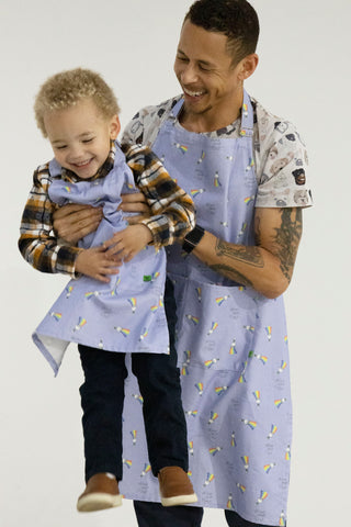 https://cabinmeasures.com/cdn/shop/products/father-son-matching-aprons_large.jpg?v=1643913937